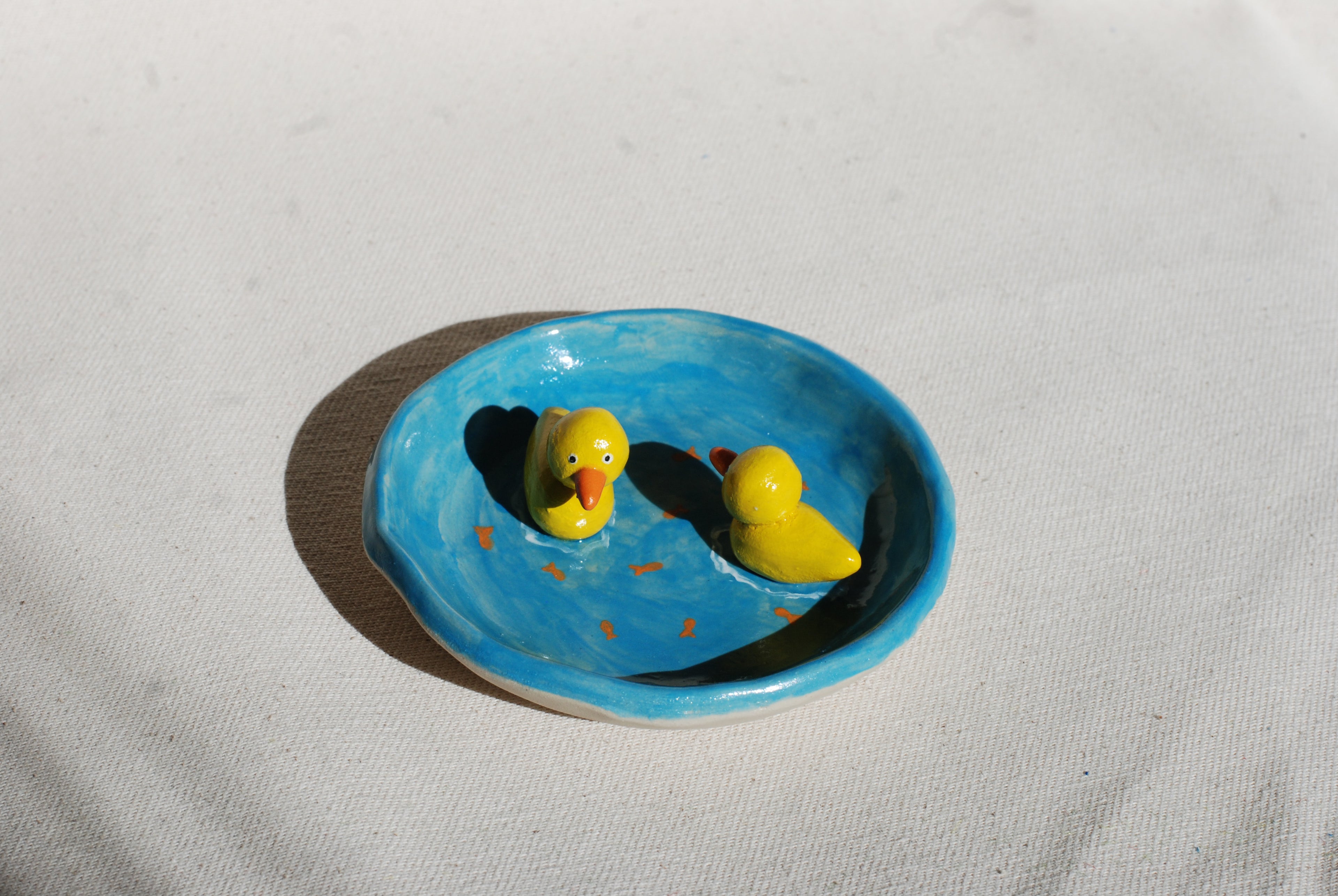 handmade stoneware trinket dish with painted pond scene, small batch ceramics Netherlands