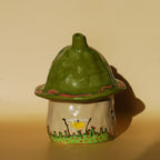 stoneware ceramic house incense holder photographed in warm natural light