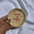 handmade ceramic trinket dish labelled shrine to pocket lint, whimsical stoneware Netherlands 