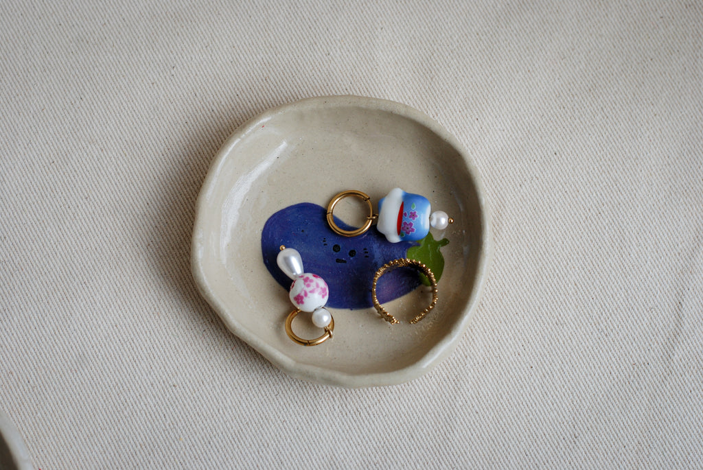 awkward aubergine friend ceramic trinket dish top view, cute handmade pottery