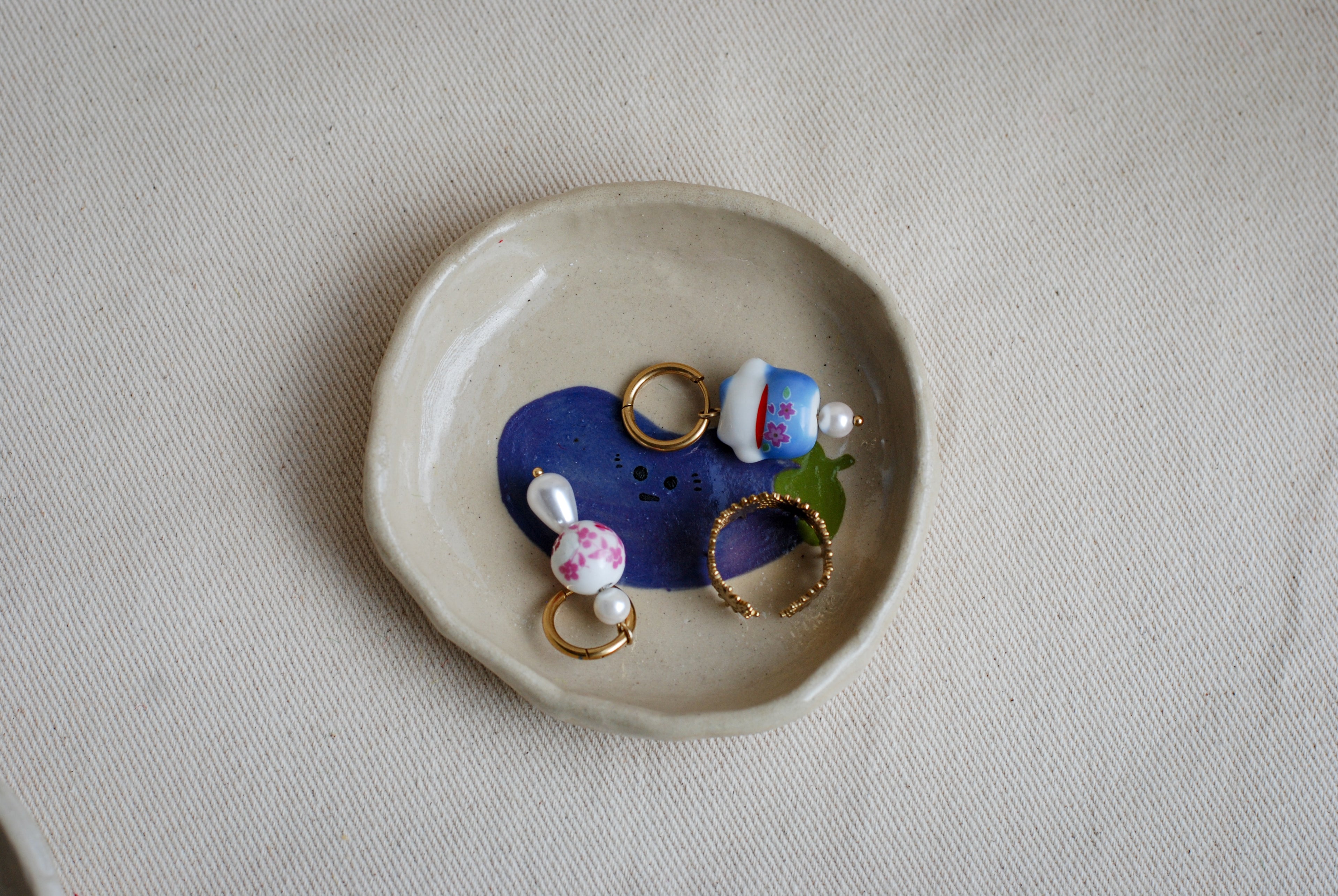 awkward aubergine friend ceramic trinket dish top view, cute handmade pottery
