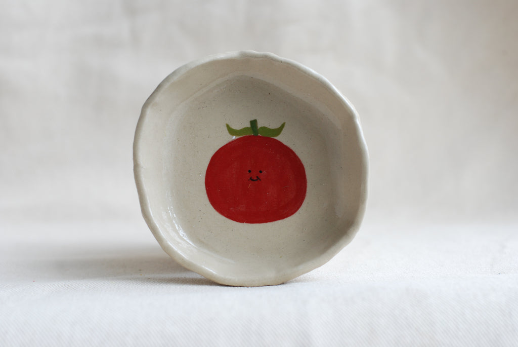 handmade ceramic trinket dish with smiling tomato