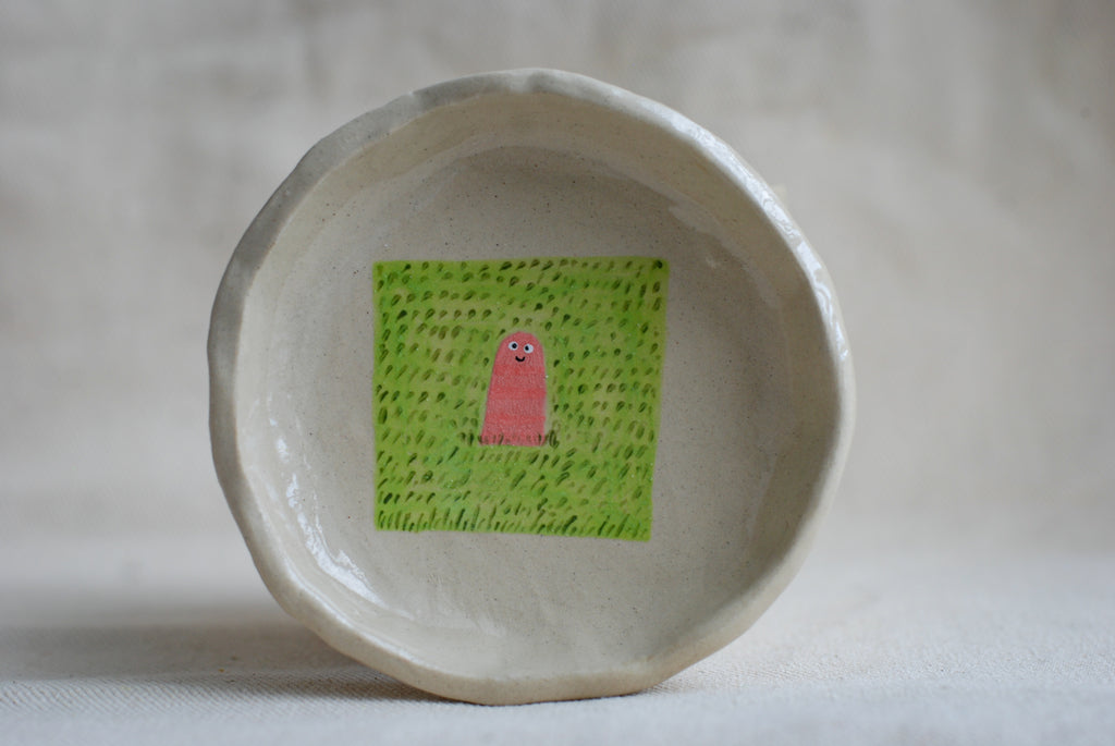 handmade ceramic trinket dish with worm illustration