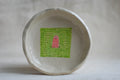 handmade ceramic trinket dish with worm illustration