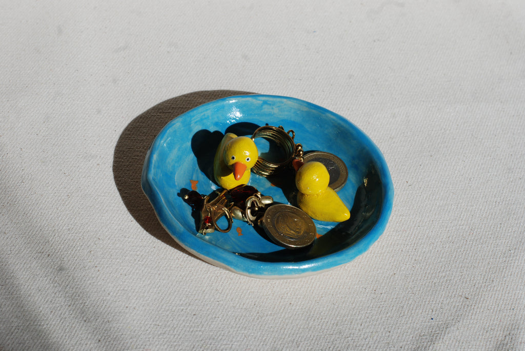 whimsical ceramic trinket dish with yellow ducks on blue pond, pipa pots