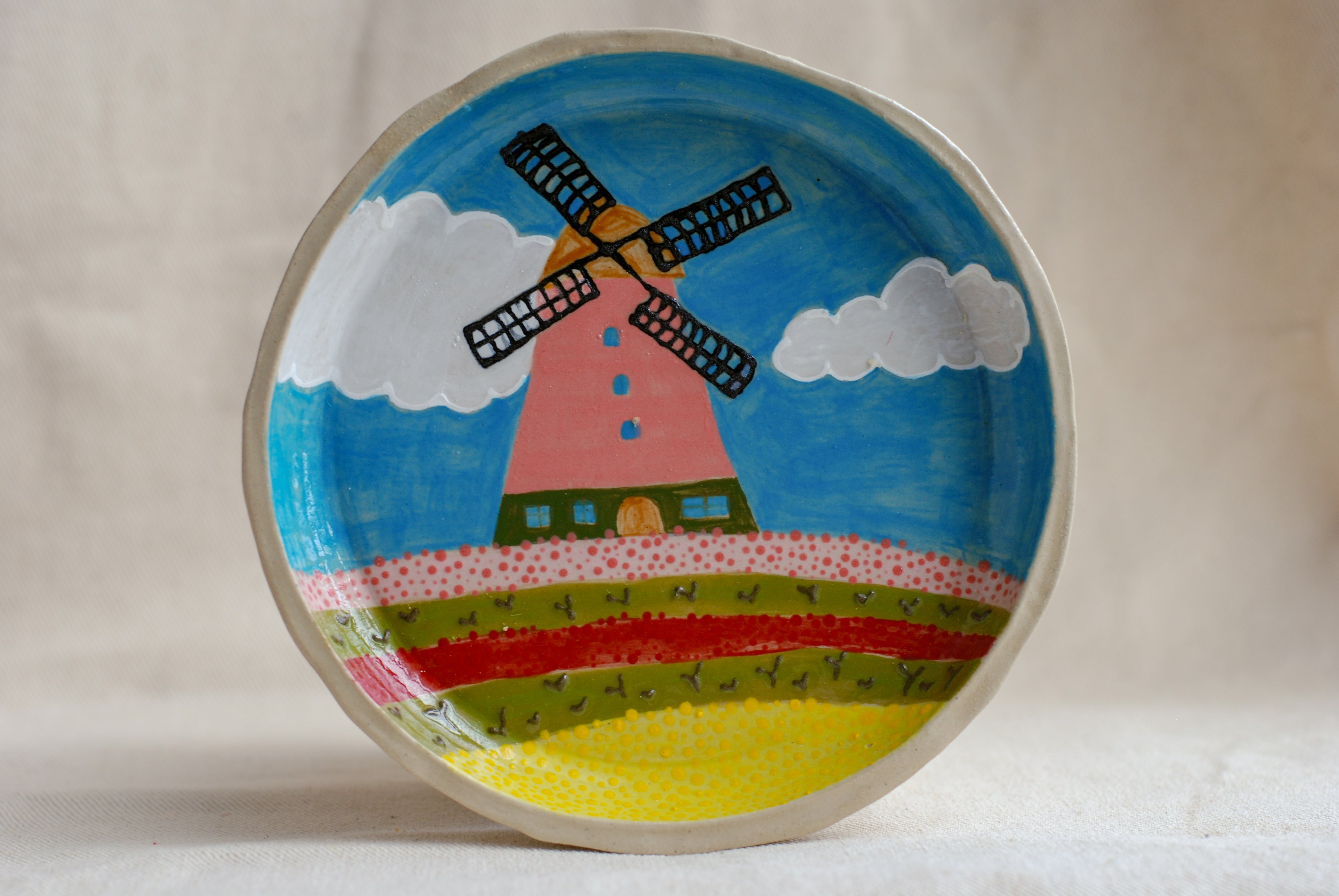 handmade ceramic plate with pink windmill illustration
