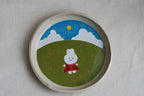 handmade ceramic plate with hand-painted bunny in flower meadow, whimsical stoneware netherlands