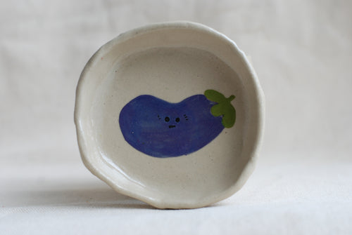 handmade ceramic trinket dish with hand-painted awkward aubergine, whimsical stoneware Netherlands