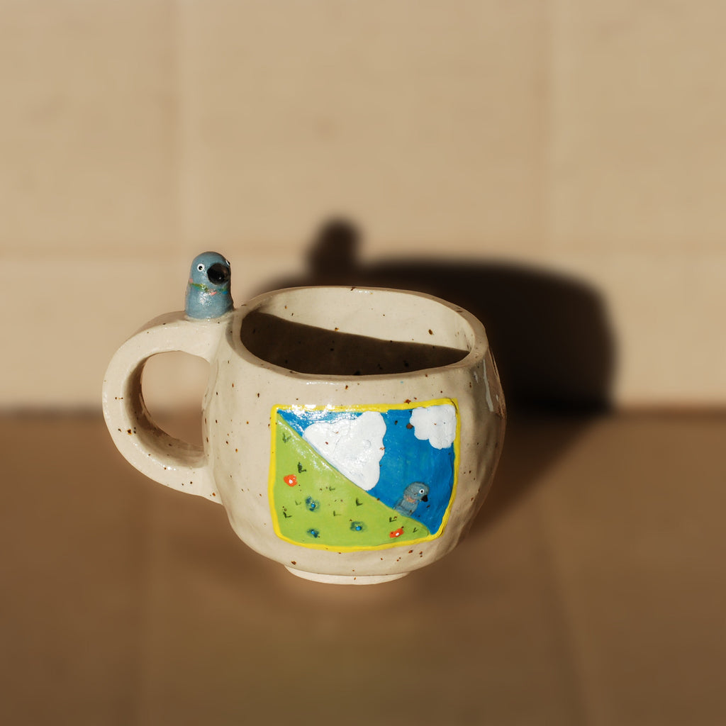 handmade whimsical ceramic bird mug with distracted pigeon face, stoneware