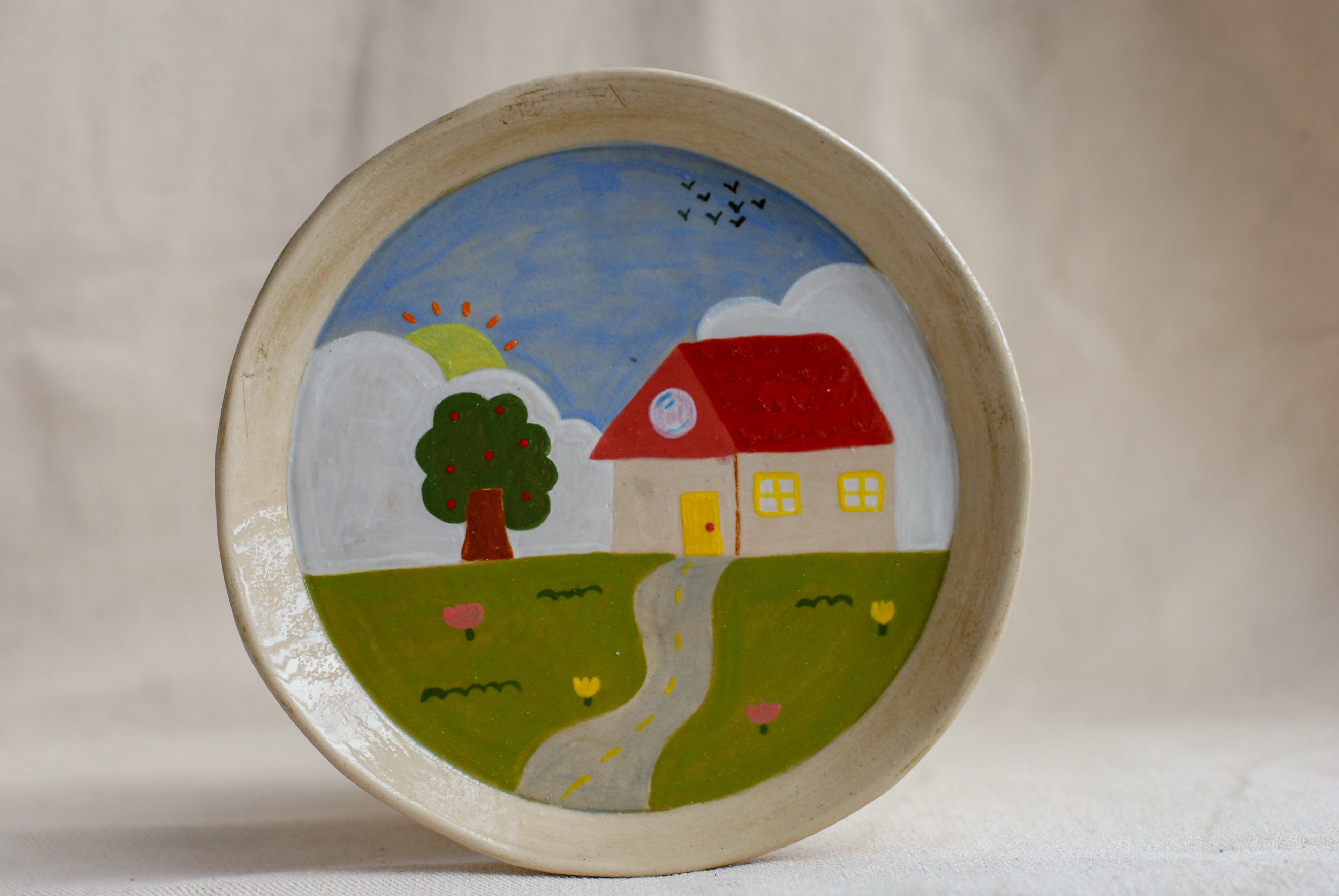 handmade ceramic plate with cottage illustration