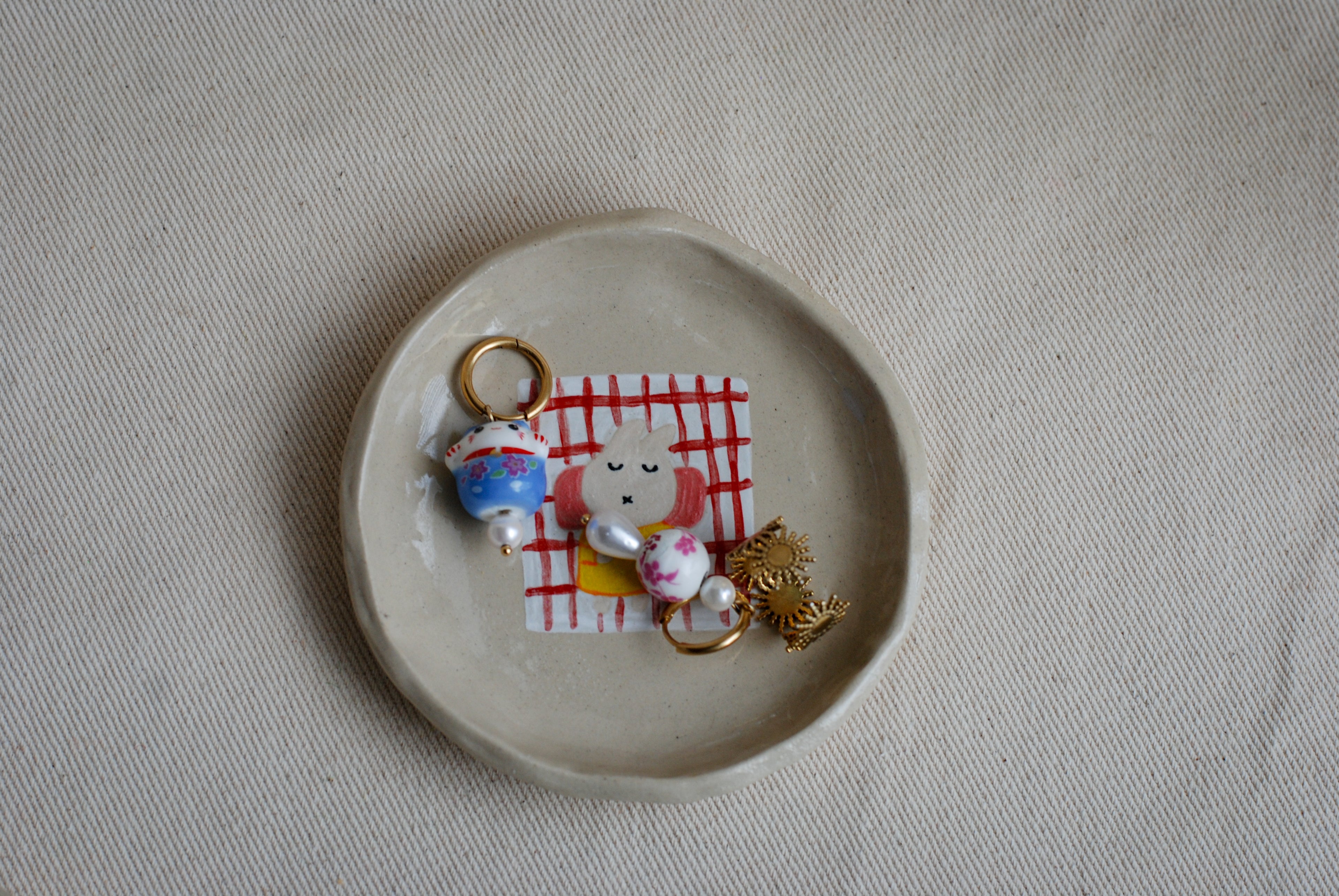 sleepy bunny ceramic dish detail, cute handmade pottery pipa pots