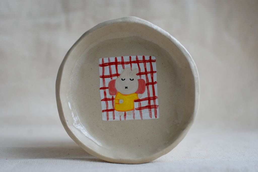 handmade ceramic trinket dish with hand-painted sleeping bunny, whimsical stoneware Netherlands