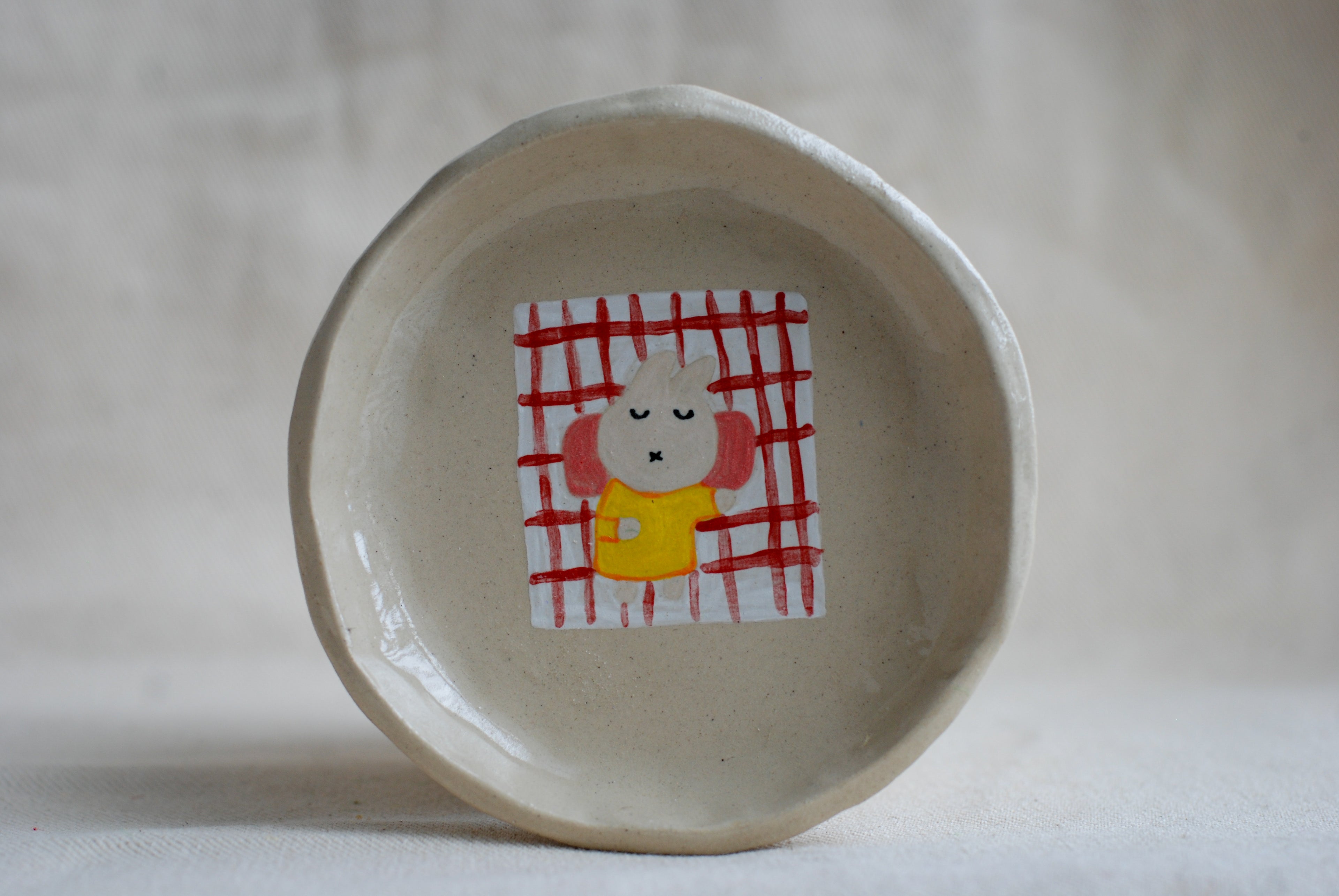 handmade ceramic trinket dish with hand-painted sleeping bunny, whimsical stoneware Netherlands